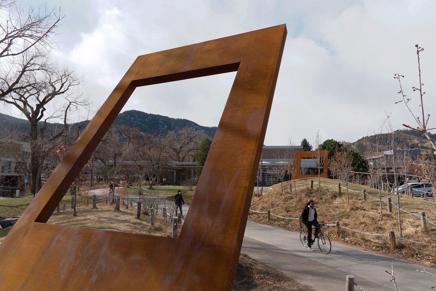 Public art on Boulder bike path with pedestrian and cyclist travel
