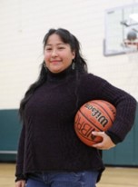 Alma Garcia, Youth Services Coordinator with Boulder Parks & Rec, holding a basketball
