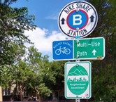 wayfinding signs for bike share station and multi-use path