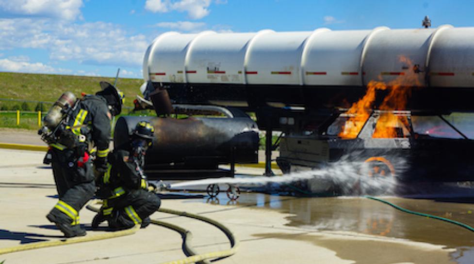 Firefighters extinguishing fire during training