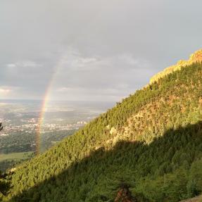 Rainbow over Chautauqua seen from Saddle Rock Trail in spring
